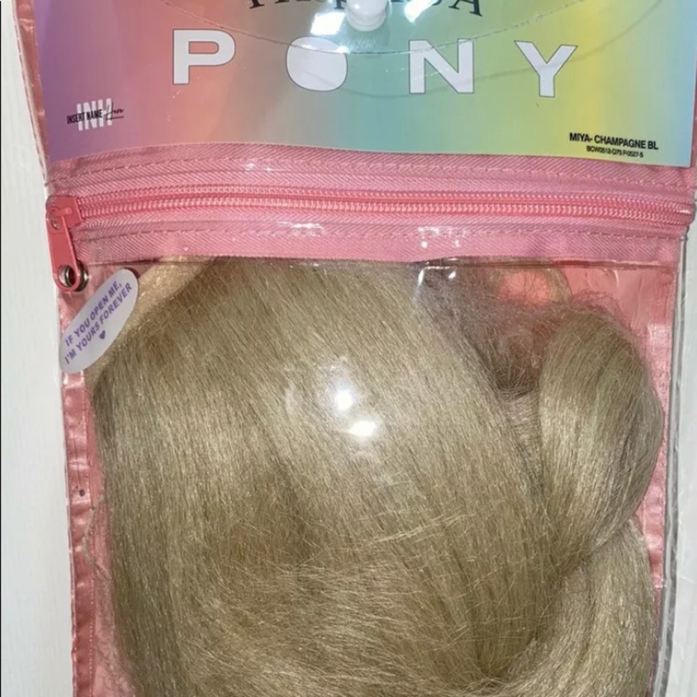 insert name here hair MIYA Champagne blonde Ponytail Extension.